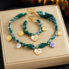 Wholesale Women's Accessories Retro Printed Stainless Steel Electroplated Heart Water Drop Bell Shaped Necklace Bracelet Suit