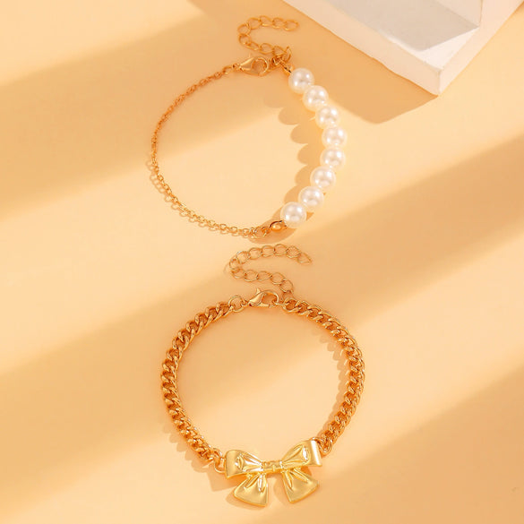 Wholesale Women's Alloy Beaded Bracelet With Irregular Imitation Pearl Stitching And Bow Tie Pendant Electroplating Design