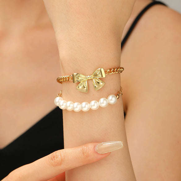 Wholesale Women's Alloy Beaded Bracelet With Irregular Imitation Pearl Stitching And Bow Tie Pendant Electroplating Design