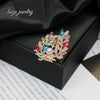 Wholesale Women's Alloy Diamond Crystal Pearl Flower Shaped Brooch With Electroplating