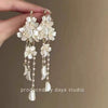 Wholesale Women's Alloy Electroplated Flower Pattern Light Luxury High Sense French Tassel Earrings