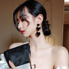 Wholesale Women's Alloy Geometric Baking Varnish Goldplated Inlaid Artificial Gem And Semiprecious Stone Tassel Long Silver Needle Earrings