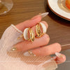 Wholesale Women's Alloy Geometric Curved Texture Earrings With Dripping Glaze And Electroplating