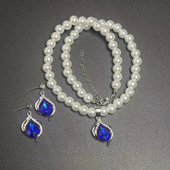Wholesale Women's Alloy Water Drops Pattern Electroplated Pearl Chain Clavicle Chain And Earrings Three Piece Set