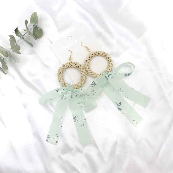 Wholesale Women's Bohemian Style Silk Straw Earrings With Doll Pattern And Ribbon Tassel