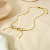 Wholesale Women's Bow Pendant Necklace With Snake Bone Chain In Titanium Steel Electroplated With 18K Gold