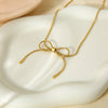 Wholesale Women's Bow Pendant Necklace With Snake Bone Chain In Titanium Steel Electroplated With 18K Gold