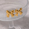 Wholesale Women's Casual Pleated Texture Bow Earrings In Titanium Steel With Vacuum Real Gold Plating