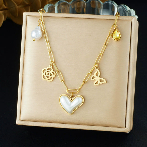 Wholesale Women's Chic Style Gold Electroplated Hollow Heart Shape Pearl Pendant Stainless Steel Necklace With Flat Cross Chain