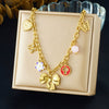 Wholesale Women's Chic Style Stainless Steel Electroplated Heart Shape Flower Bow Tie Pendant Necklace