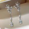Wholesale Women's Copper Dropshaped Flower Inlaid Zircon Earrings