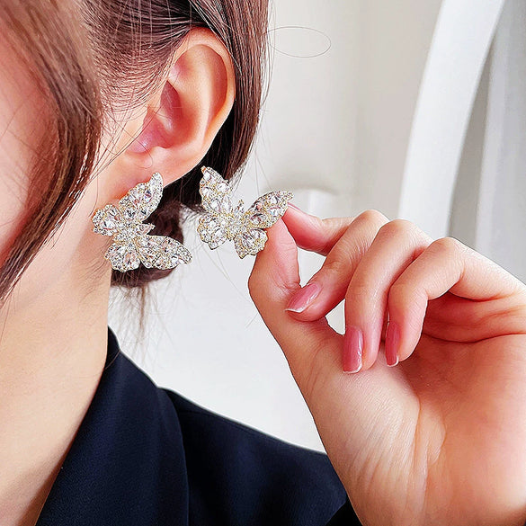 Wholesale Women's Copper Earrings With Bow Pattern And Zircon Treatment In Simple And Animal Style