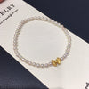 Wholesale Women's Copper Freshwater Pearl Elastic Bracelet With Blessing Lock And Lotus Sand Gold Colorpreserving Perfect Circle Shape