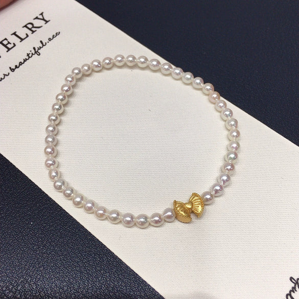 Wholesale Women's Copper Freshwater Pearl Elastic Bracelet With Blessing Lock And Lotus Sand Gold Colorpreserving Perfect Circle Shape