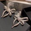 Wholesale Women's Copper Geometric Shiny Bow Earrings