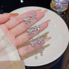 Wholesale Women's Copper Light Luxury Bow Tassel Earrings Inlaid Zircon