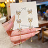 Wholesale Women's Copper Light Luxury Bow Tassel Earrings Inlaid Zircon