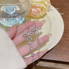 Wholesale Women's Copper Zircon Bow Long Tassel Earrings