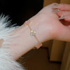 Wholesale Women's Copper Zircon Inlaid Fourpetal Flower Geometric Sweet Style Bracelet Real Gold Electroplated