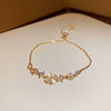 Wholesale Women's Copper Zircon Inlaid Fourpetal Flower Geometric Sweet Style Bracelet Real Gold Electroplated