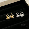 Wholesale Women's Dropshaped Diamondinlaid Copper Hollow Earrings With Minimalist Design