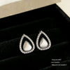 Wholesale Women's Dropshaped Diamondinlaid Copper Hollow Earrings With Minimalist Design