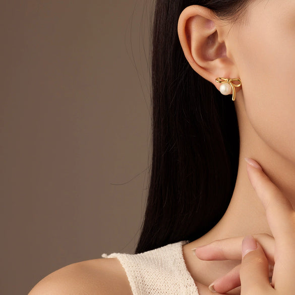 Wholesale Women's Elegant Bow Pearl Titanium Steel Electroplated Earrings Fashion Simple No Fading