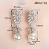 Wholesale Women's Elegant Geometric Plant Flowers Imitation Pearl Copper Electroplated Wedding Dress Earrings