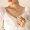Wholesale Women's Elegant Titanium Steel Snake Bone Chain Necklace With Peach Heart Pendant And Geometric Design