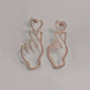 Wholesale Women's Fashion Geometric Copper Hollowout Heart Earrings With Electroplating