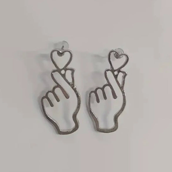 Wholesale Women's Fashion Geometric Copper Hollowout Heart Earrings With Electroplating