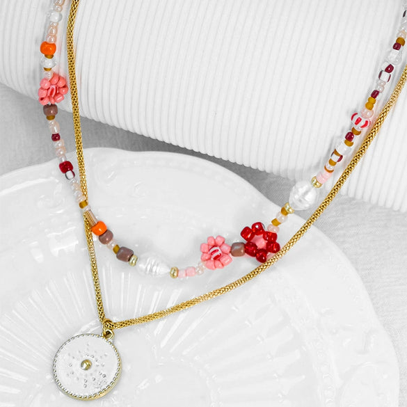 Wholesale Women's Fashion Geometric Stainless Steel And Pearl Beaded Sunflower Pendant Necklace With Electroplating Treatment