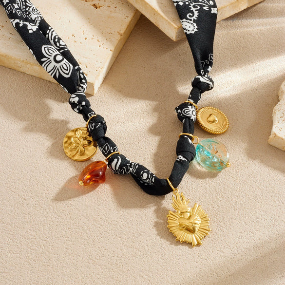Wholesale Women's Fashion Retro Creative Heartshaped Stainless Steel Goldplated Relief Flower Pattern Beaded Pendant Necklace With Rope Chain