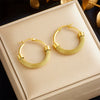 Wholesale Women's Fashion Retro Geometric Titanium Steel Round Twist Earrings With Electroplating