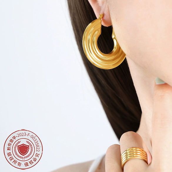 Wholesale Women's Fashion Simple Temperament Large Disc Hollow U Shaped Titanium Steel Gold Plated Earrings With Geometric Design