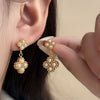 Wholesale Women's Fashion Titanium Steel Flower Four Petal Pearl Embellished Electroplated Earrings