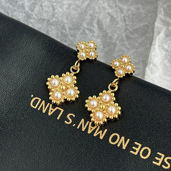 Wholesale Women's Fashion Titanium Steel Flower Four Petal Pearl Embellished Electroplated Earrings