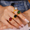 Wholesale Women's French Court Style Oval Glass Stone Ring In Titanium Steel Plated With 18K Gold And Geometric Design