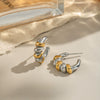 Wholesale Women's Geometric Contrasting Color Twist Earrings In Stainless Steel With Electroplating
