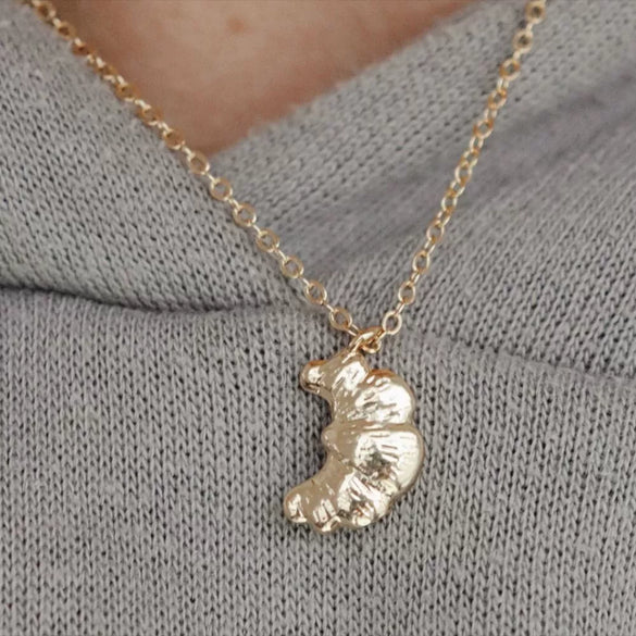 Wholesale Women's Geometric Fruit Food Style Croissant Pendant Necklace Made Of Stainless Steel And Titanium Steel With Electroplating