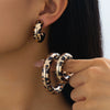 Wholesale Women's Geometric Leopard Print Cshaped Alloy Electroplated Hoop Earrings