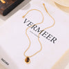 Wholesale Women's Geometric Oval Inlaid Tiger Eye Pendant Necklace With 18K Gold Plated Titanium Steel