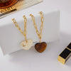 Wholesale Women's Geometric Stainless Steel And Resin Electroplated Pendant Necklace