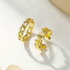 Wholesale Women's Geometric Stainless Steel Electroplated Hollow Twist Ring With Flower Design