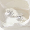 Wholesale Women's Geometric Stainless Steel 18K Gold Electroplated Threedimensional Hollow Flower Stud Earrings