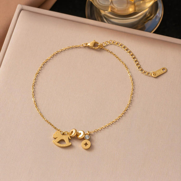 Wholesale Women's Geometric Stainless Steel Real Gold Plated Bracelet With Four Leaf Clover Pendant