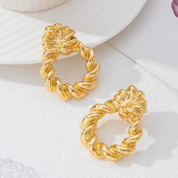 Wholesale Women's Geometric Twist Pattern Circle Alloy Earrings With Stainless Steel Ear Needles Electroplated