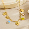Wholesale Women's Goldplated Stainless Steel Heart Shape And Flower Pattern Hollow Pendant Necklace With Cross Chain