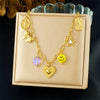 Wholesale Women's Goldplated Stainless Steel Heart Shape And Flower Pattern Hollow Pendant Necklace With Cross Chain