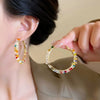 Wholesale Women's Handmade Plastic And Resin Flowershaped Tassel Earrings Little Fresh Style